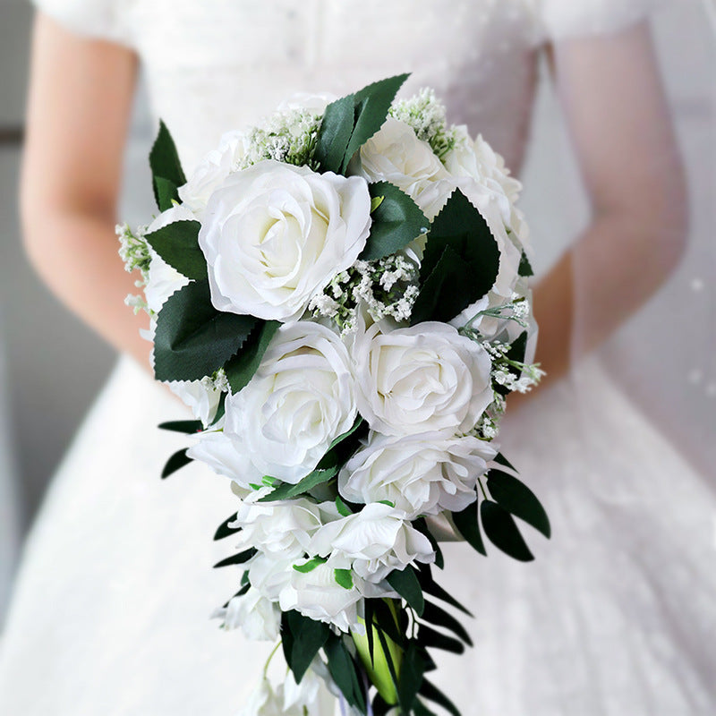 Waterfall white flowers bouquet with artificial roses and greenery, perfect for maternity photoshoots and special occasions.