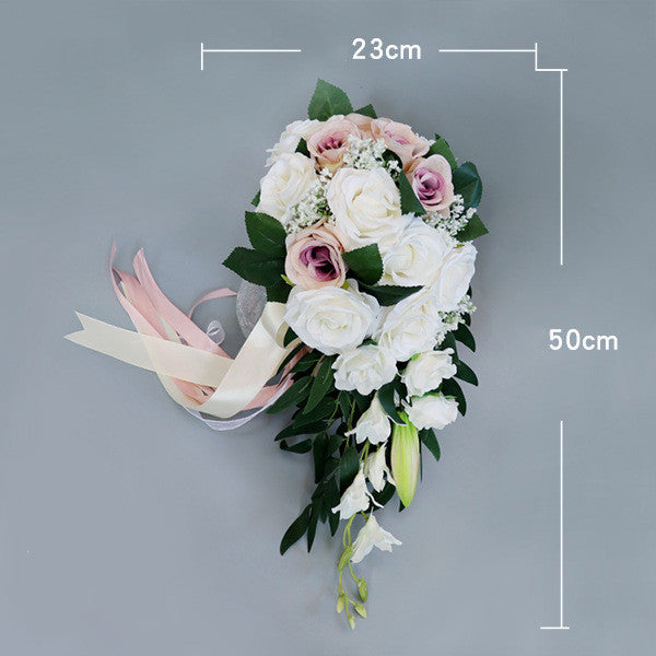 Waterfall-style bouquet of white and pink artificial flowers with green leaves, measuring 23cm by 50cm.
