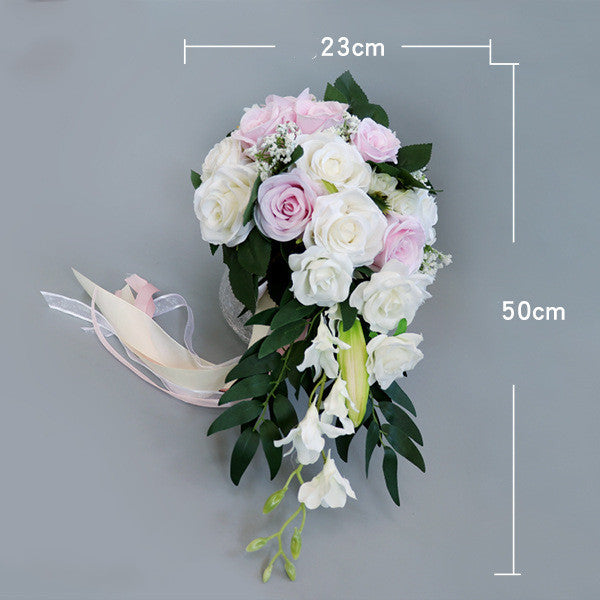 Waterfall-style artificial white flowers bouquet with pink accents, ideal for maternity occasions.