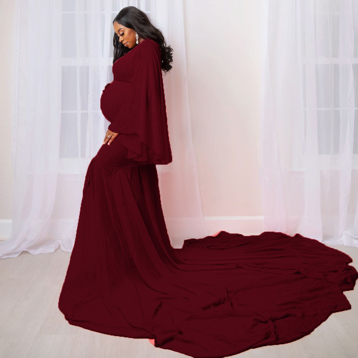 Maternity long flowing dress with a solid color design, perfect for elegant pregnancy photoshoots.