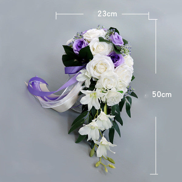 Waterfall-style bouquet with white and purple artificial flowers, perfect for maternity occasions.